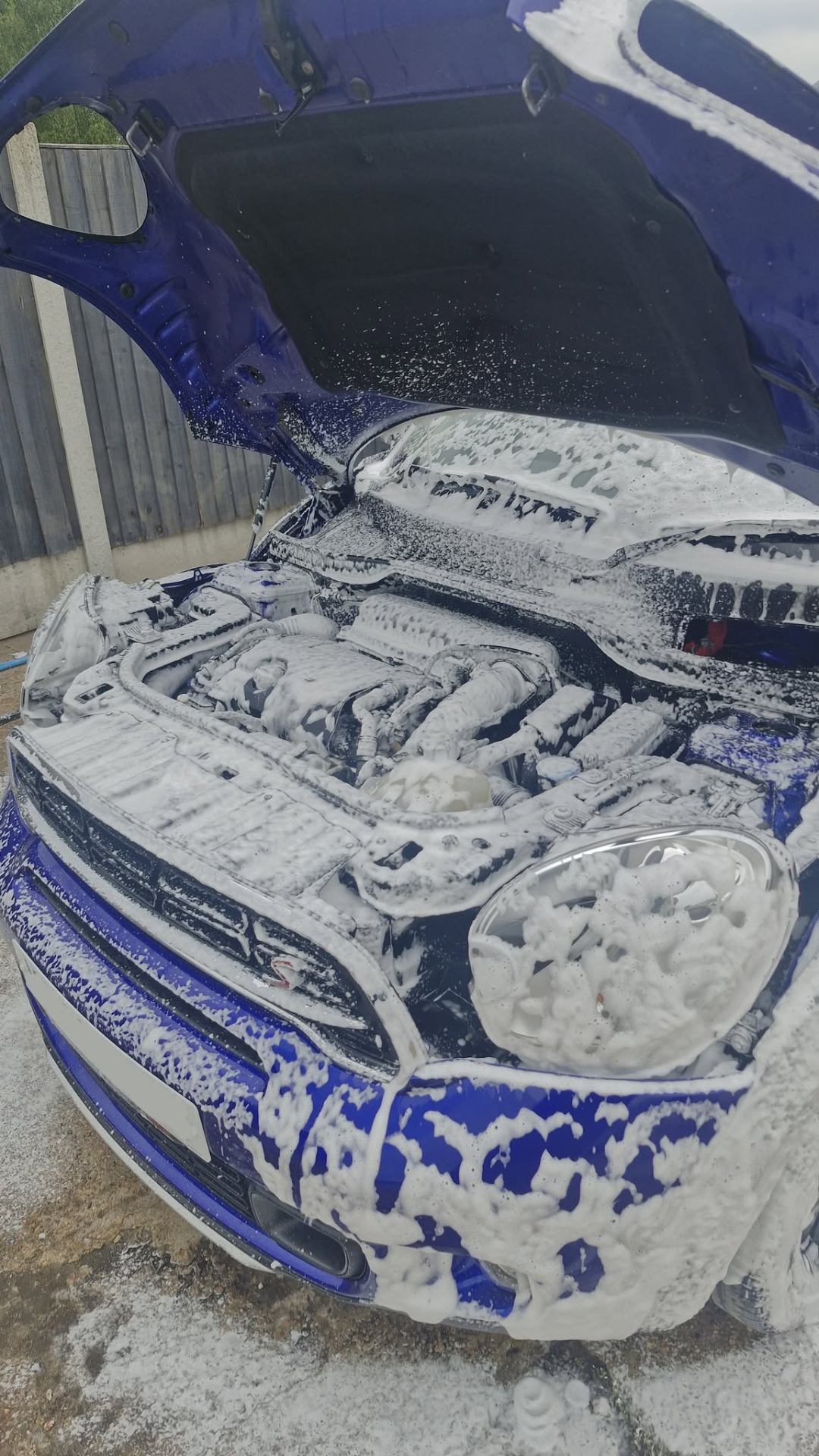Mini Cooper engine bay covered in snow foam during engine bay clean