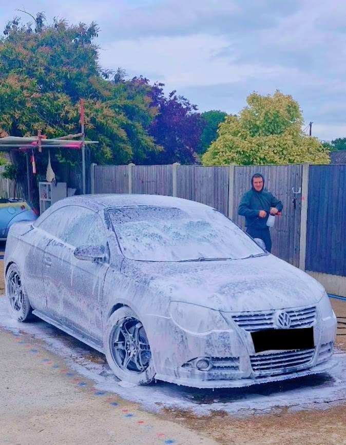 Ben Collins snow-foaming a Volkswagen Eos at the Tailored Detail studio in Hockley, Essex