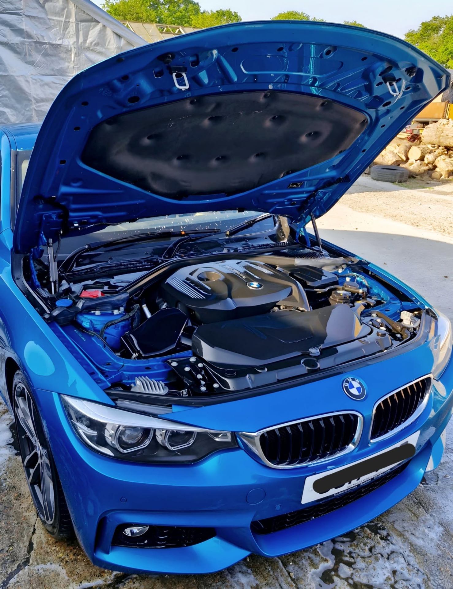 Clean BMW engine bay after professional engine bay cleaning service